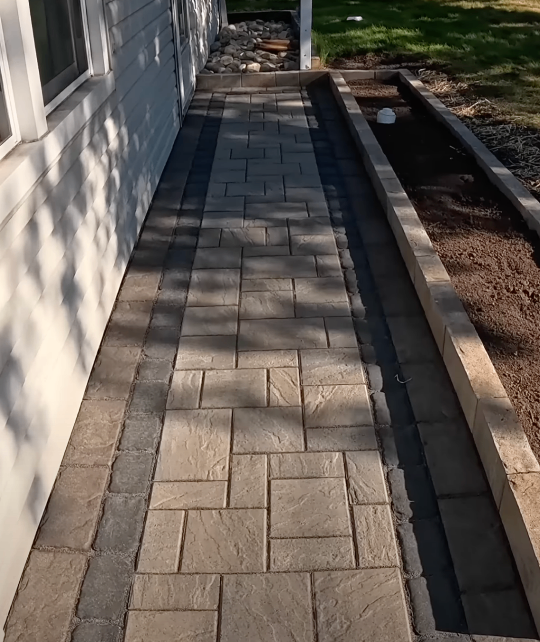 crew replacing two heaved sidewalk squares on a tree-lined Clintonville street
